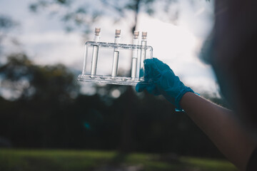 During a field study in nature, the science team collected each water sample carefully, conducting thorough testing and detailed research to better understand environmental change. © Atthapon