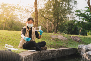 Fototapeta premium In the field, science teams note each water sample and liquid change in nature, conducting research, testing, and detailed analysis to understand the environment.