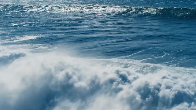 Powerful ocean waves crash and foam, creating a dynamic natural seascape