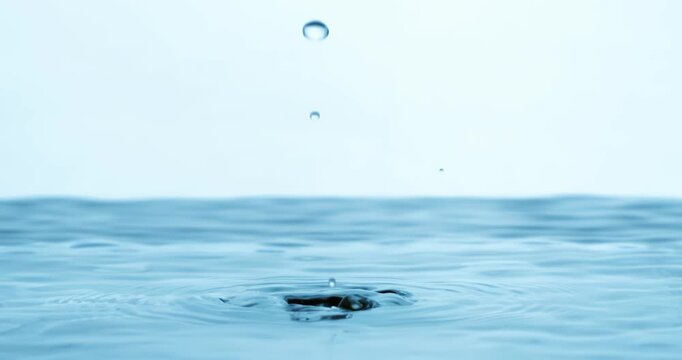Water Drops close-up of water falls in a super slow motion. Shot on super slow motion camera 1600 fps.