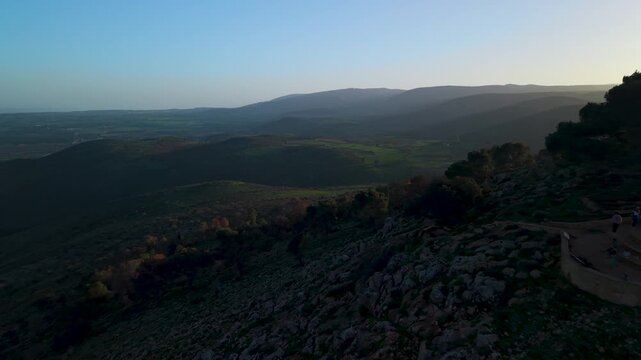 Keren Naftali viewpoint in Israel during a golden hour flight toward the mountainous horizon and natural forest area.