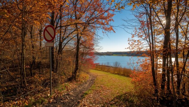 Autumn hiking route by the Kiel Canal with a no-stopping sign