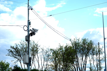 Obraz premium camera cameras. cctv pole security. surveillance street video. sky tree monitor.
