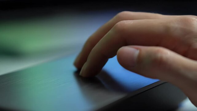Close up of one person's hand using a finger to touch a blue screen, technology background