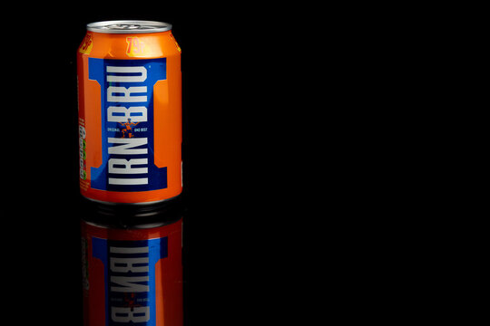 A Can of Iru Bru against a black background