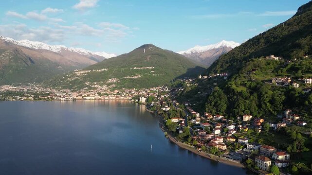 Lake Como at Sunrise, Italy &ndash; 4K Drone View of Alpine Lakeside Village, Tiled Roof Homes, Blue Water and Snowy Alps Peaks, Cinematic European Travel Destination