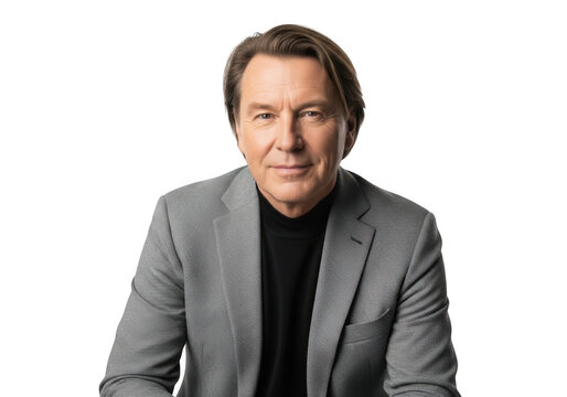 A man wearing a black shirt and a gray patterned jacket, smiling and looking at the camera, isolated on transparent background