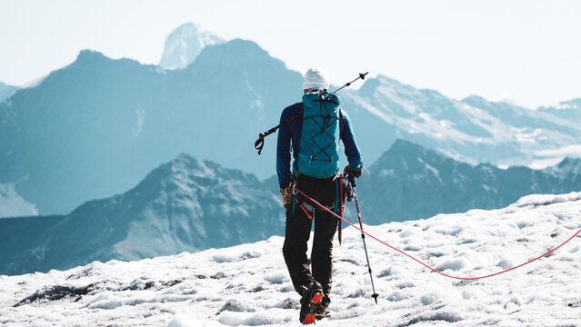 Alpine Guide Leading a Rope Party Down a Mont Blanc Glacier Toward the Valais Alps on the Haute Route