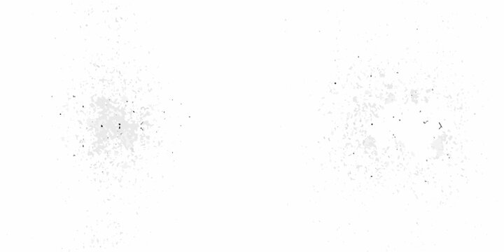 Abstract white texture with scattered dark specks and grainy imperfections