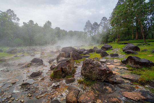 Jae son Hot Spring: Steam from geothermal heat rises from the spring. Located in Jae son National Park, Lampang Province, Thailand.