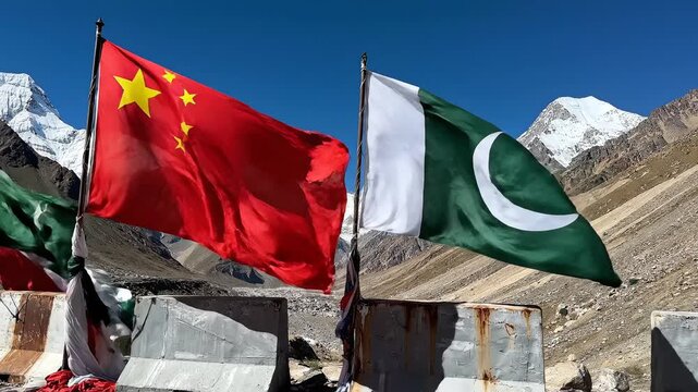 Flags of China and Pakistan in mountainous terrain