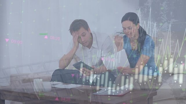 Animation of financial data processing over stressed caucasian couple calculating finance
