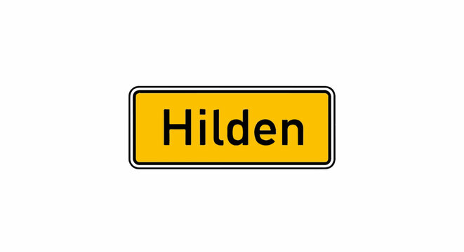 Yellow rectangular sign with black border and text "Hilden" on white background