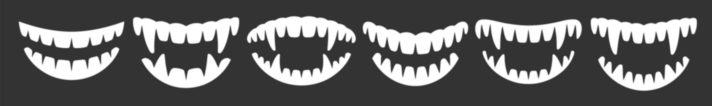  set of different vampire fangs isolated on dark background