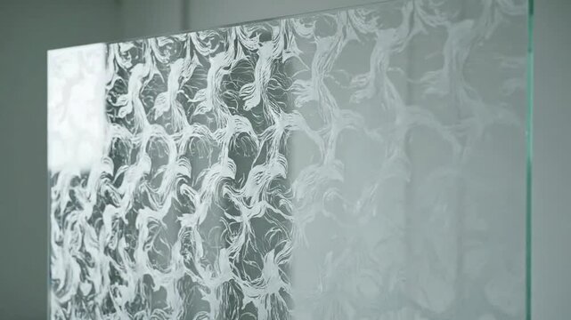 Frosted glass panel with intricate floral pattern design.