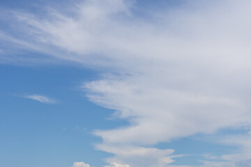 Obraz premium The sky is blue and cloudy. The clouds are white and fluffy. The sky is clear and bright.