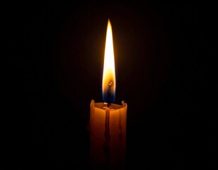 Burning candle with glowing flame isolated on dark background, symbol of hope and spirituality.