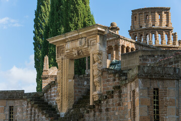 Fototapeta premium Ornate stone archway and tower at La Scarzuola architectural complex