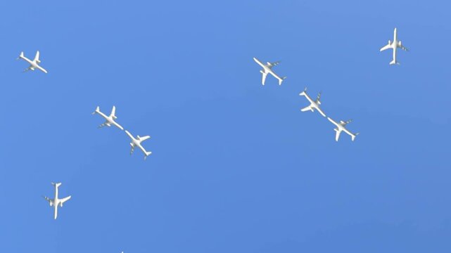 Commercial jets crossing the skies, planes or air traffic. Multiple aircraft passing above against clear blue sky. Keying ready.