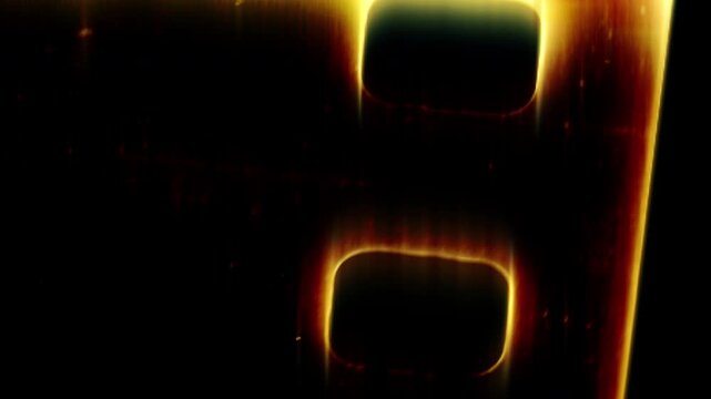 Burning film strip frame transition with cinematic analog glow and vintage movie texture