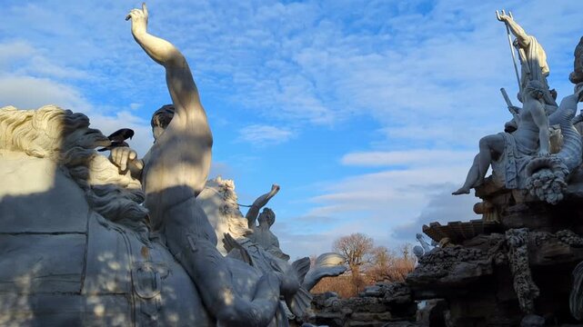 Baroque fountain statues at Belvedere Palace gardens in Vienna Austria