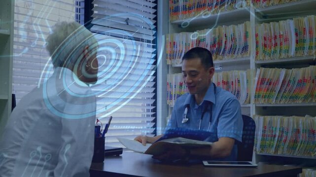 Doctor opening chart causing circular overlay over patient, reviewing records and explaining care