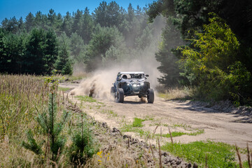 UTV buggy, 4x4 competition on dusty road. Rally, extreme, adrenalin © Antonio