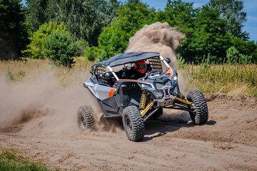 Fototapeta premium ATV, UTV, buggy, rally riding in dusty track. Amateur competitions