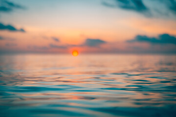 Abstract ocean view with blurred horizon and sun for dreamlike nature background featuring shallow...