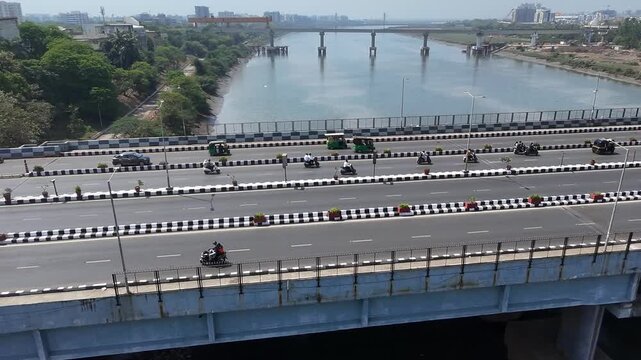 Busy Highway Traffic Near River Bridge in Surat City India Sunny Day Aerial Drone Shot