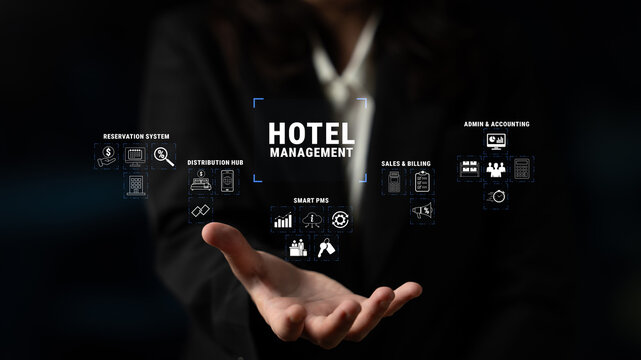Woman Holding Digital Interface for Hotel Management Systems Showcasing Reservation System, Distribution Hub, Smart PMS, and Admin Functions Quark.