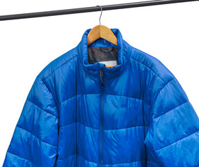 Blue puffer jacket hangs on wooden hanger against grey background. Quilted outerwear rests on metal...