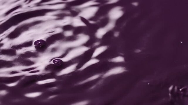 Purple Liquid Splashing and Flowing Slow Motion.