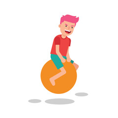 Boy happily bouncing on a large orange exercise ball.