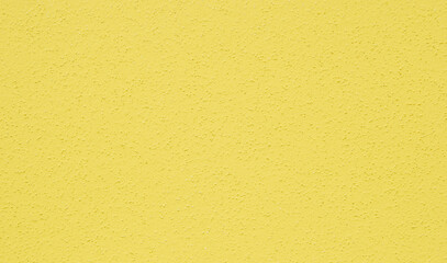 Obraz premium Yellow plastered dry wall texture