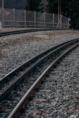 Obraz premium Cogwheel Railway Tracks among Alpine Meadows, Famous Location in Switzerland.