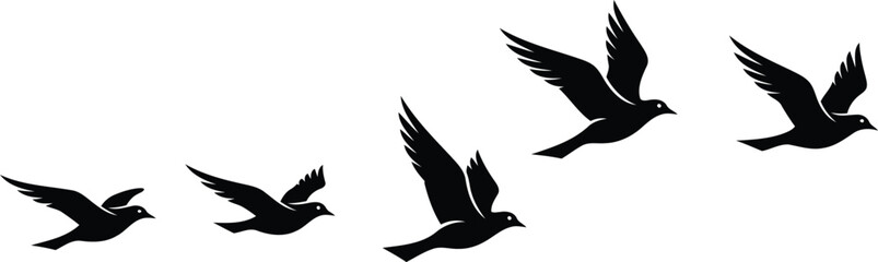 Fototapeta premium black silhouettes of birds flying in different positions