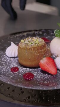 Delicious Chocolate Lava Cake souffle with Powdered Sugar and ice cream kitchen preparation High quality FullHD footage