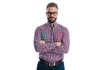 Fototapeta premium Confident casual man standing with arms crossed