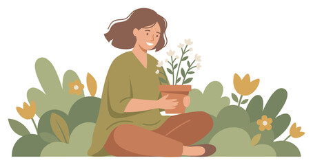 Smiling woman holds potted white flowers while sitting happily among green plants and blooming spring flowers.