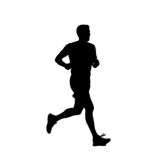 Obraz premium Silhouette of a runner in motion showing athletic form and dynamic movement during exercise.