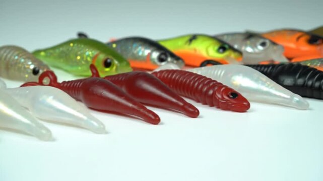 Colorful soft plastic fishing lures on a white background