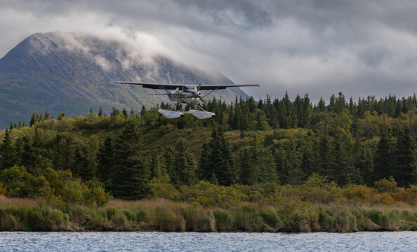 A float plane landing in the mountains 