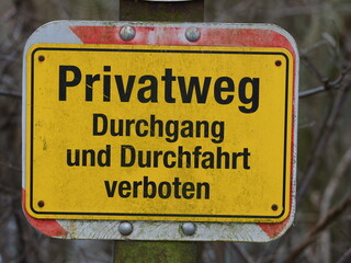 Fototapeta premium German yellow warning sign: Private road, no entry or through traffic