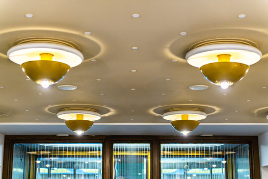 Ceiling lights in the entrance area of Altmarkt Karree, East German (GDR-era) fixtures, historic interior design.