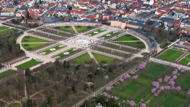 An panoramic aerial view beside the old town an palace of the city Schwetzingen in Germany on a sunny early spring morning during the cherry blossom season.