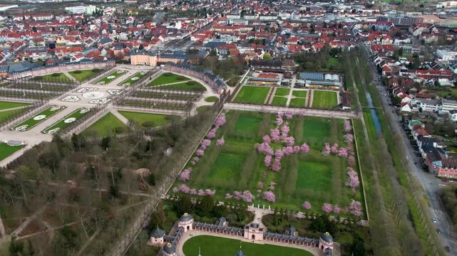 An panoramic aerial view beside the old town an palace of the city Schwetzingen in Germany on a sunny early spring morning during the cherry blossom season.