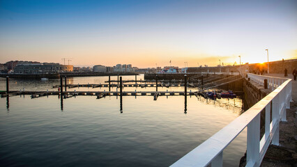 Fototapeta premium Golden Hour at the Marina Harbor in Gijon city, Asturias, Spain