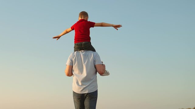 happy family father son child kid baby flight pilot superhero sky dream, father supporting child, fun fatherhood, father child interaction, pretend play outside, strength and care, nurturing childhood