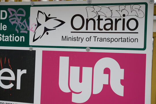 Ontario Ministry of Transportation and Lyft logo signs in Toronto